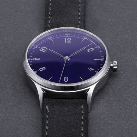 A close up view of the translucent blue dial